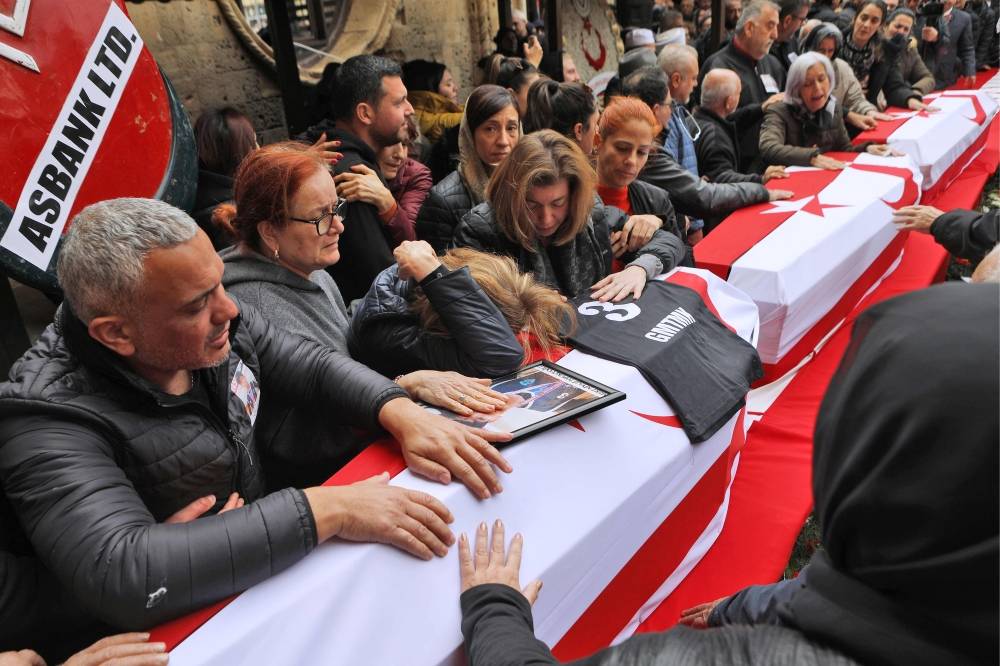 Mourners attend the funeral of seven Cypriot students killed in a powerful earthquake that hit Turkey, on February 10, 2023. (Credit: Birol Bebek/AFP)


