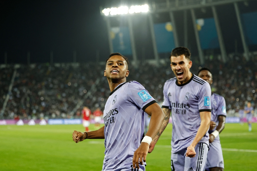 Real Madrid's Brazilian forward Rodrygo (left) celebrates scoring his team's third goal during the FIFA Club World Cup semi-final football match between Egypt's Al-Ahly and Spain's Real Madrid at the Prince Moulay Abdellah Stadium in Rabat on February 8, 2023. (Photo by Khaled DESOUKI / AFP)