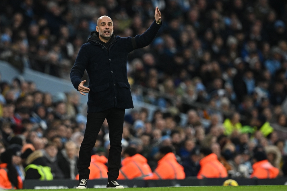 Manchester City's Spanish manager Pep Guardiola gestures on the touchline during the English Premier League match between Manchester City and Aston Villa at the Etihad Stadium in Manchester, north west England, on February 12, 2023. (Photo by Paul ELLIS / AFP)