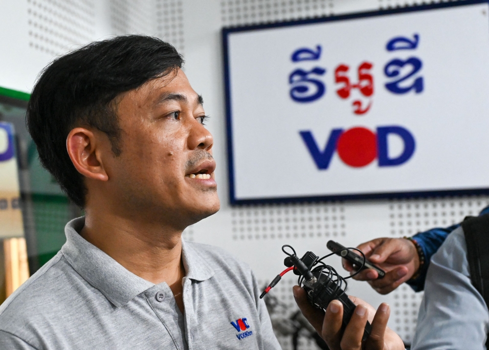 Ith Sothoeuth, media director of the Cambodian Centre for Independent Media (CCIM) which oversees VOD, speaks to media at his office in Phnom Penh on February 13, 2023, after Cambodian Prime Minister said VOD would have its operating licence revoked. - Cambodia's strongman leader late on February 12 ordered the shutdown of one of the country's few remaining local independent media outlets after taking issue with a news report about his son. (Photo by TANG CHHIN Sothy and TANG CHHIN SOTHY / AFP)