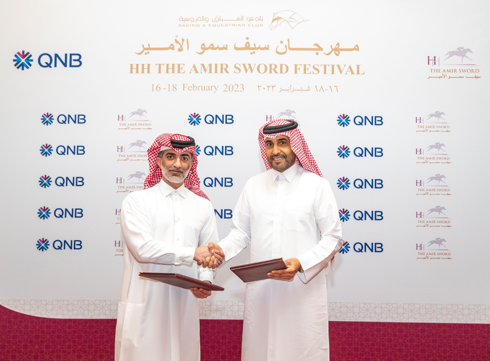 QREC Chairman Issa bin Mohammed Al Mohannadi and QNB Vice President External Communications Yousef Fakhroo shake hands after renewing the partnership.  