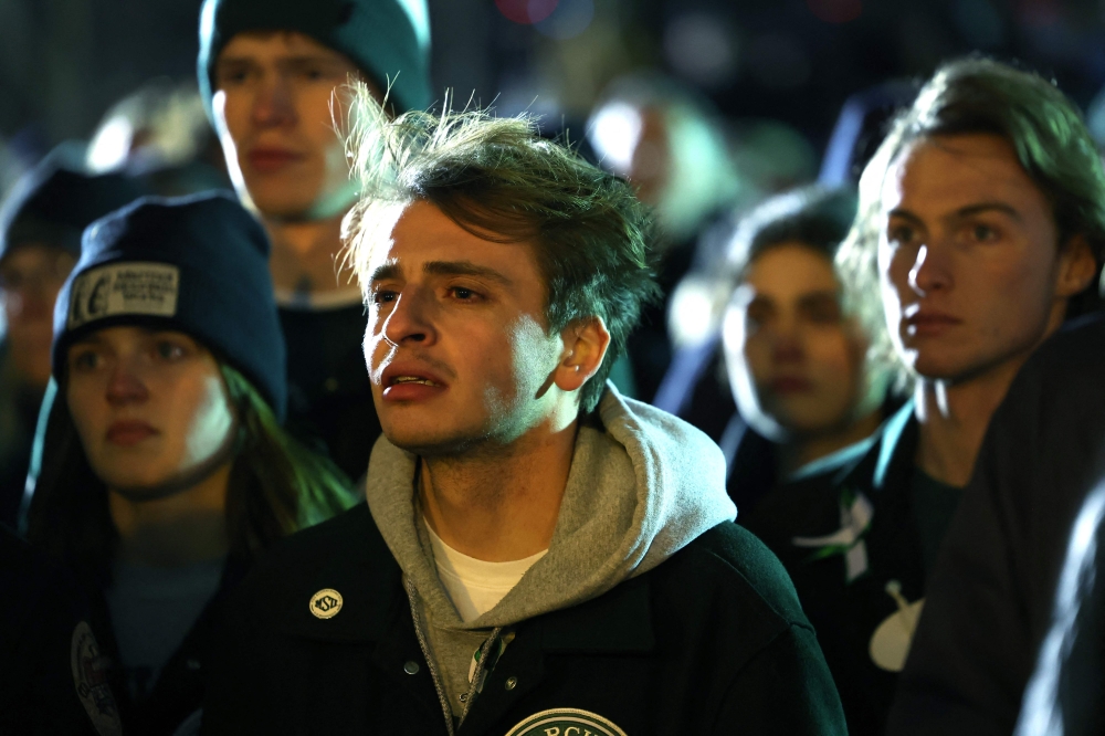 Students, faculty and others in the community attend a vigil on the campus of Michigan State University following Monday's shooting on February 15, 2023 in East Lansing, Michigan. Photo by SCOTT OLSON / GETTY IMAGES NORTH AMERICA / Getty Images via AFP
