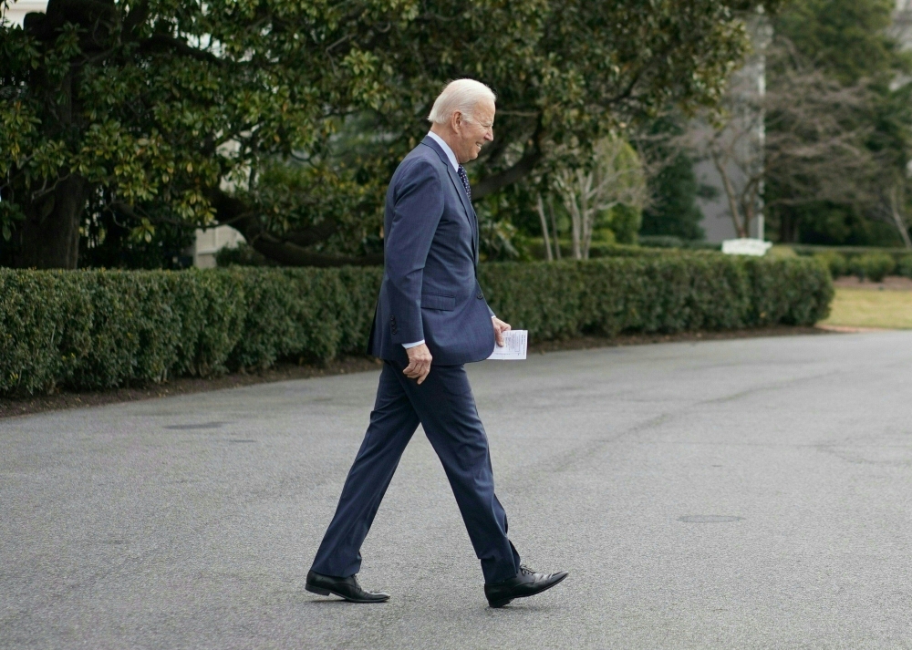 US President Joe Biden walks to Marine One on the South Lawn of the White House in Washington, DC on February 16, 2023. - President Biden will undergo a physical examination at Walter Reed National Military Medical Center this morning. (Photo by Mandel NGAN / AFP)