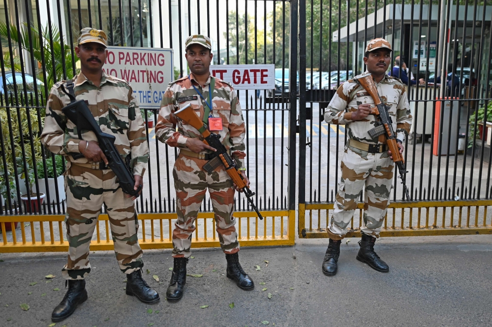 Indo-Tibetan Border Police stand guard outside the office building where Indian tax authorities raided BBC's office in New Delhi on February 15, 2023, following a protest against the BBC by Hindu Sena activists, an Indian right-wing organization. (Photo by Sajjad Hussain / AFP)