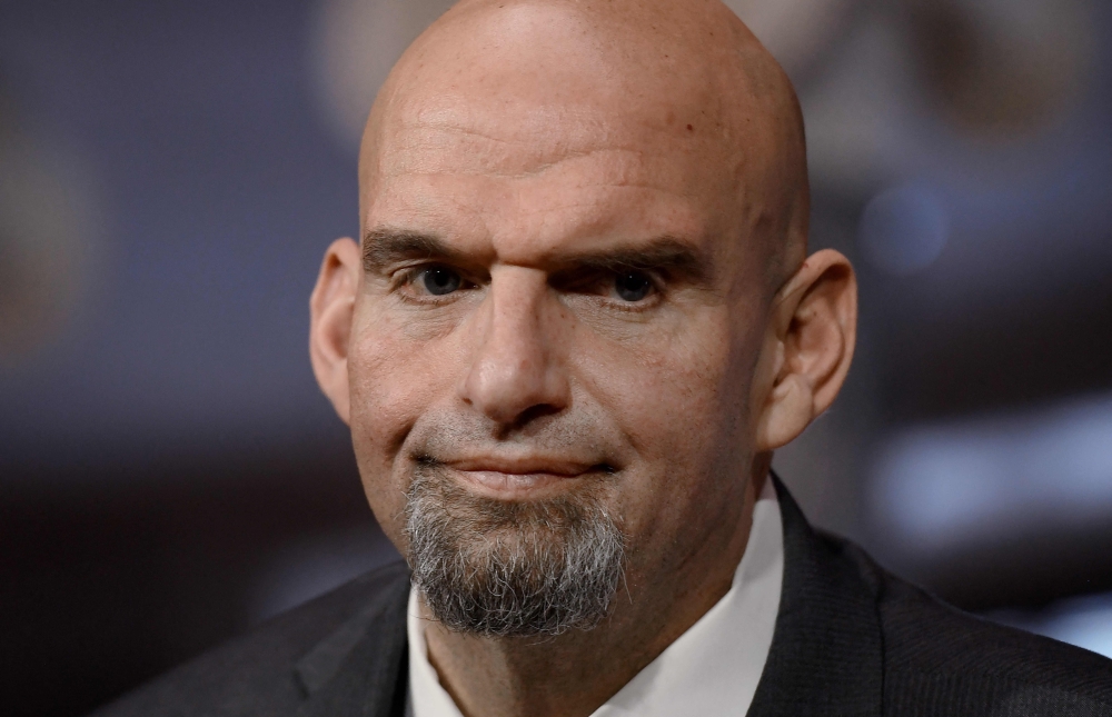 (FILES) In this file photo taken on January 3, 2023 US Democratic Senator from Pennsylvania John fetterman looks on as he is ceremonially sworn in by Vice President Kamala Harris for the 118th Congress in the Old Senate Chamber at the US Capitol in Washington, DC. (Photo by OLIVIER DOULIERY / AFP)
