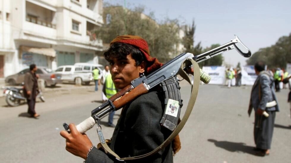 A Houthi supporter looks on as he carries a weapon during a gathering in Sanaa, Yemen on April 2, 2020.