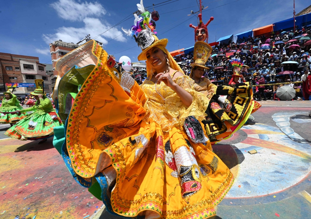 Dancers of the Waca Waca San Agustin group perform during the Oruro Carnival in Oruro, Bolivia, on February 18, 2023. (Photo by AIZAR RALDES / AFP)