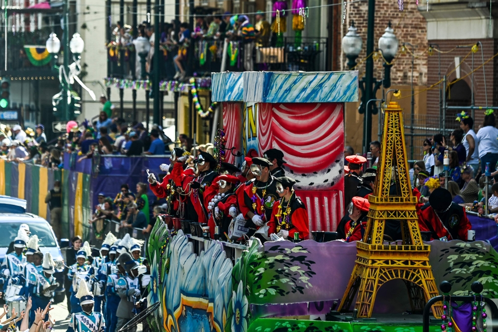 People participate in the 2023 Krewe of Okeanos parade during Mardi Gras in New Orleans, Louisiana, on February 19, 2022. (Photo by CHANDAN KHANNA / AFP)