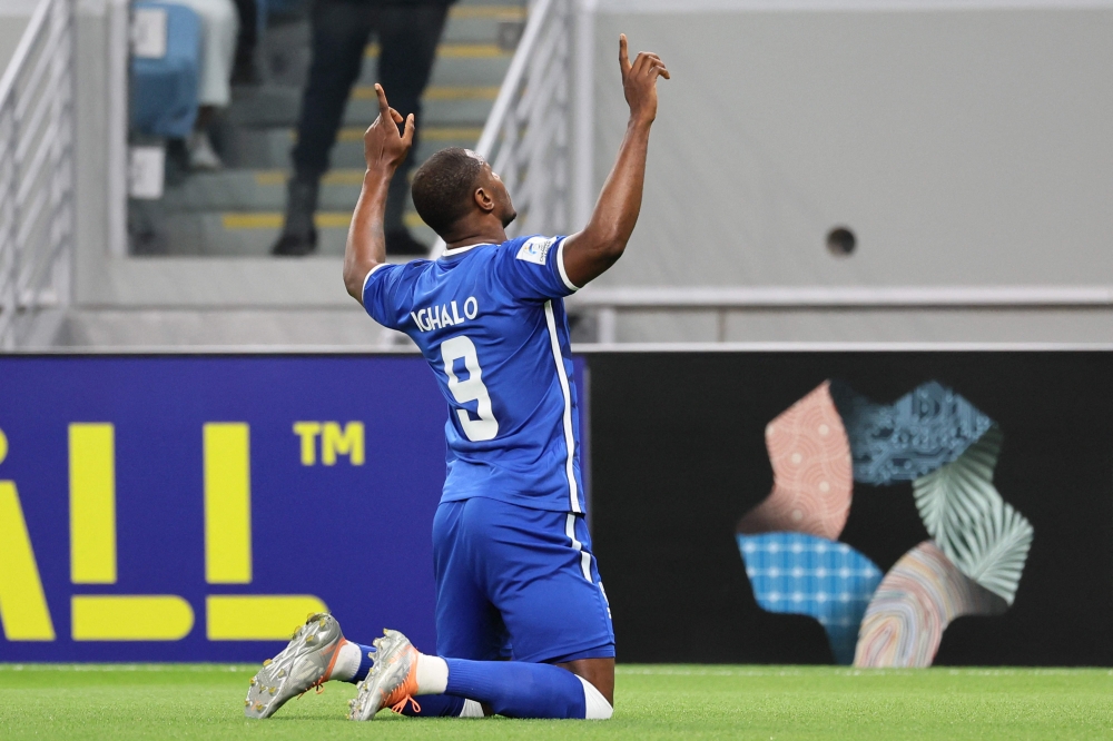Hilal's Nigerian forward Odion Ighalo celebrates scoring his team's first goal during the AFC Champions League round of 16 match between Saudi Arabia's Al-Hilal and UAE's Shabab Al-Ahli at the Al-Janoub Stadium in Al-Wakrah, south of Doha on February 20, 2023. (Photo by KARIM JAAFAR / AFP)