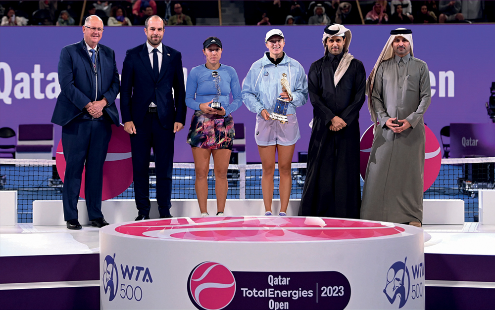 Qatar, Tennis, Squash and Badminton Federation President Nasser bin Ghanim Al Khelaifi and TotalEnergies Qatar Country Chair and TotalEnergies EP Qatar Managing Director Matthieu Bouyer with the Qatar TotalEnergies Open finalists and officials following the presentation ceremony.