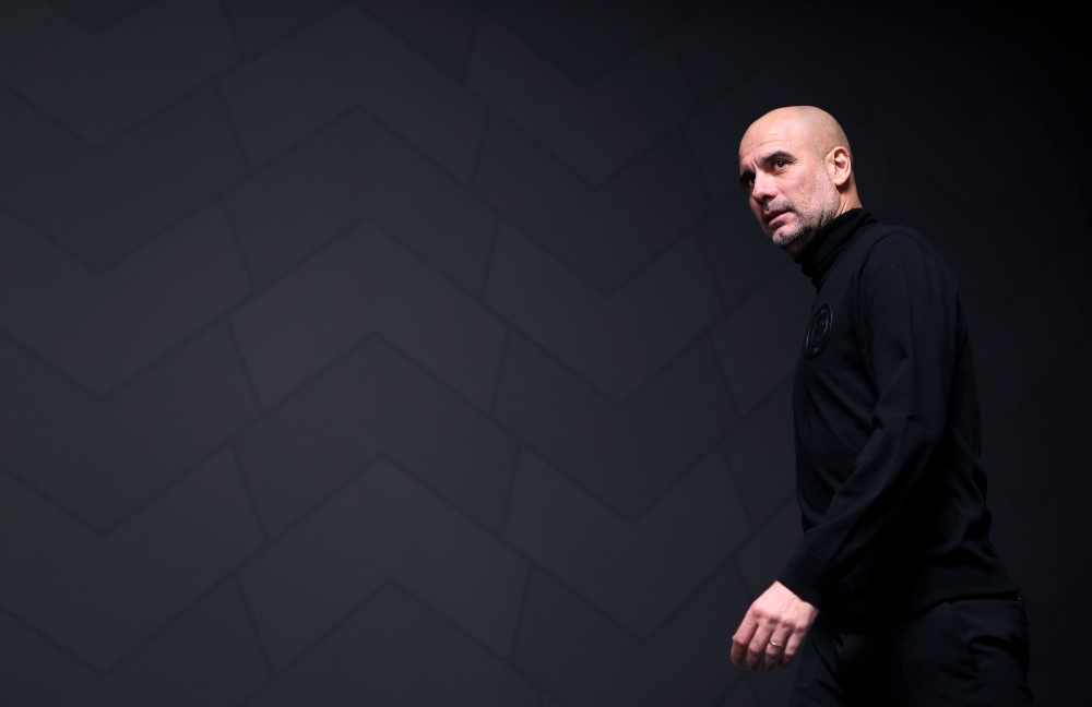 Manchester City's manager Pep Guardiola arrives to deliver a press conference in Leipzig, eastern Germany on February 21, 2023, on the eve of the UEFA Champions League round of 16 match against RB Leipzig. (Photo by Ronny HARTMANN / AFP)