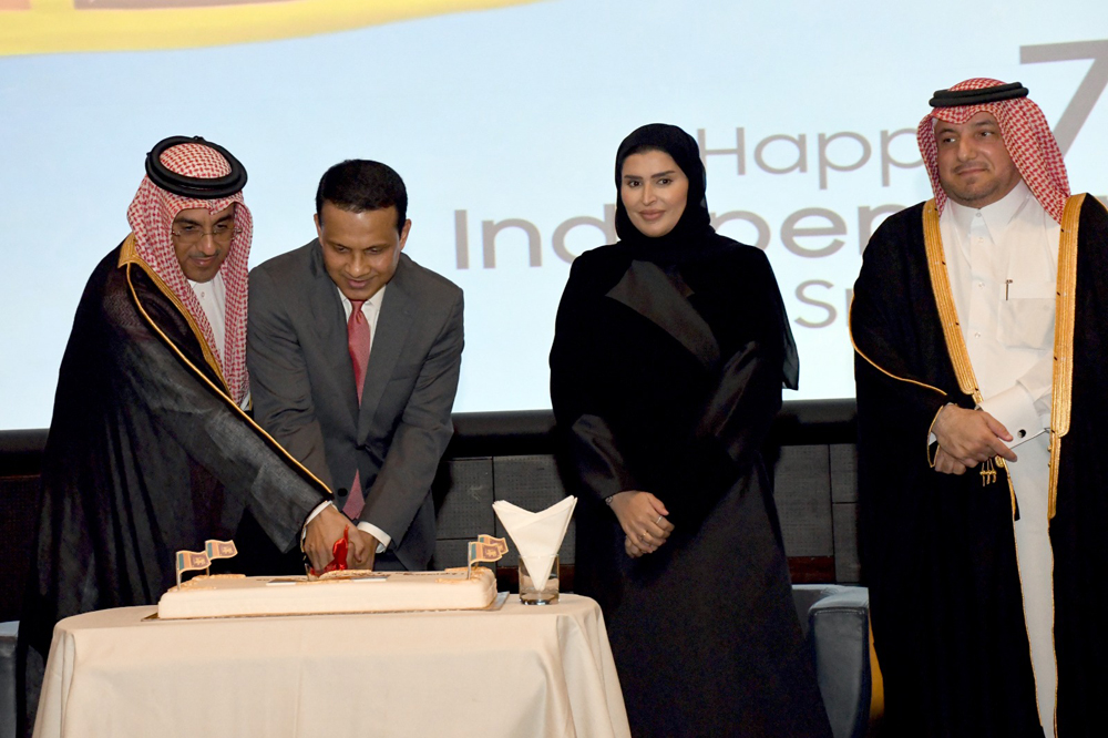 Minister of Labour H E Dr. Ali bin Smaikh Al Marri (left); Minister of Social Development and Family H E Maryam bint Ali bin Nasser Al Misnad (second right); Director of the Protocol Department Ambassador H E Ibrahim Yousif Abdullah Fakhroo (right), and Ambassador of Sri Lanka H E Mohamed Mafaz Mohideen at the ceremonial cake cutting  during a reception held on Tuesday to mark the 75th Independence Day of Sri Lanka. 