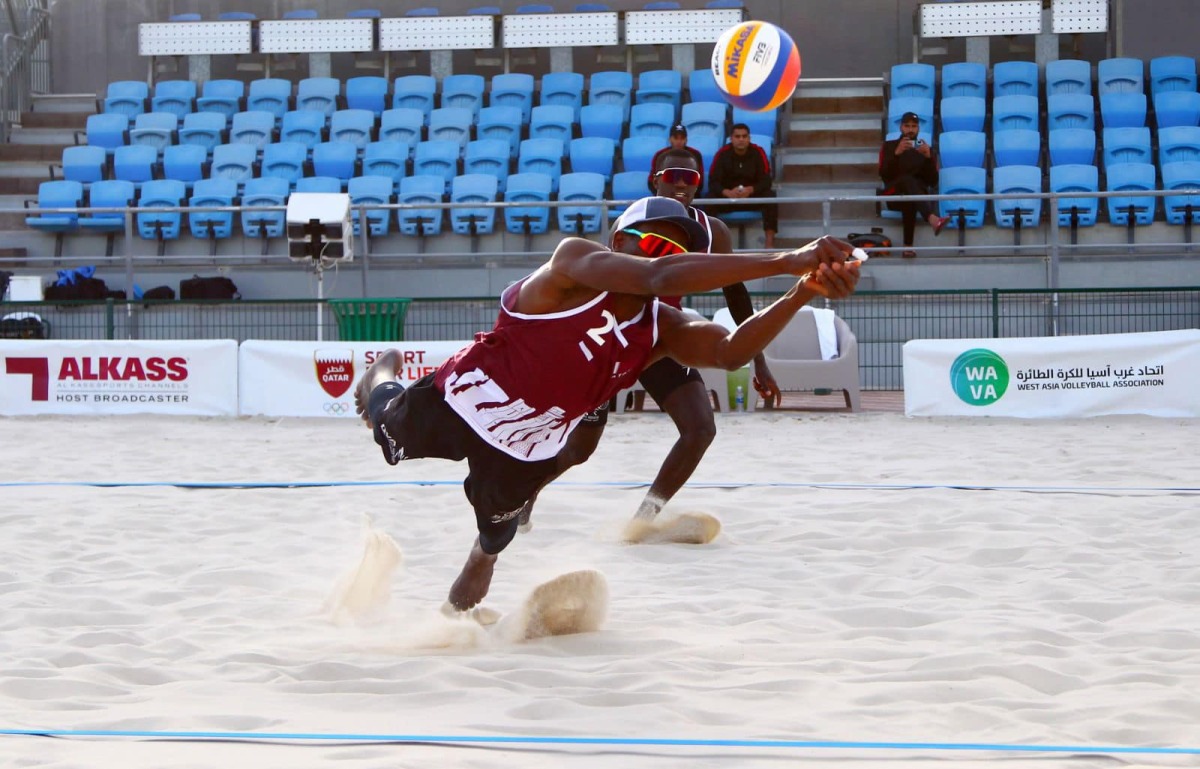 Qatar A's Cherif Younousse and Ahmed Tijan in action.