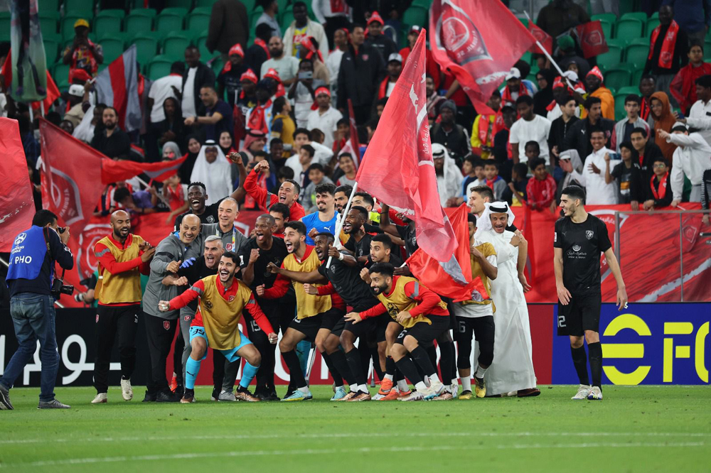 Al Duhail players and officials celebrate after their historic win yesterday. 