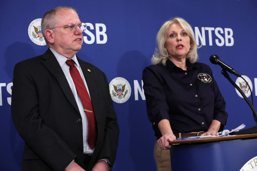 WASHINGTON, DC - FEBRUARY 23: Chair of the National Transportation Safety Board (NTSB) Jennifer Homendy speaks as Director of the NTSB Office of Railroad, Pipeline and Hazardous Materials Robert Hall listens during a news briefing on the East Palestine Northern Southern freight train derailment at the NTSB headquarters on February 23, 2023 in Washington, DC. (Photo by ALEX WONG / GETTY IMAGES NORTH AMERICA / Getty Images via AFP)