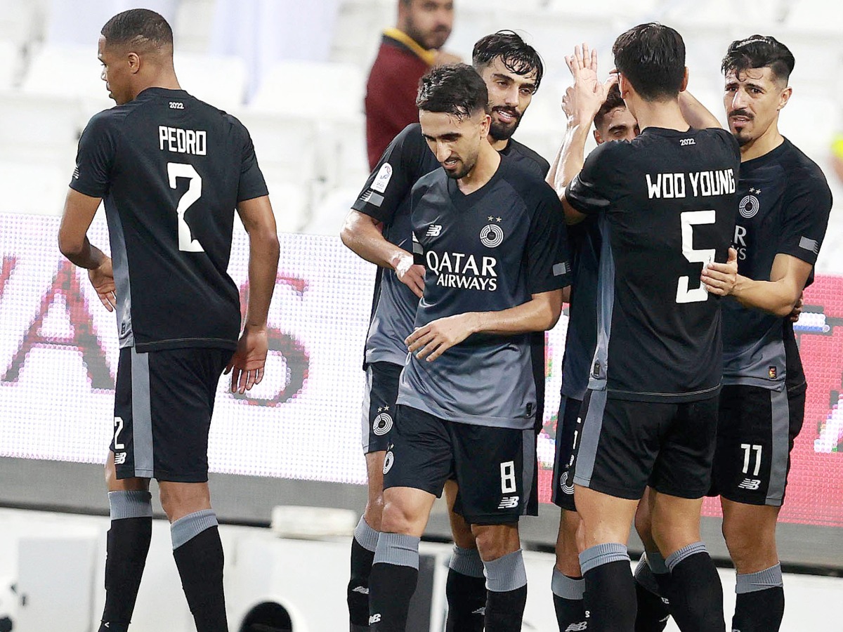 Al Sadd players celebrate after Hassan Al Haydos scored their first goal . 