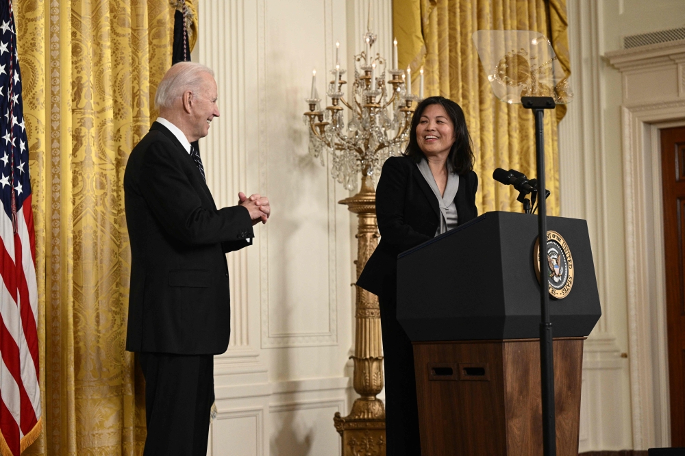 US President Joe Biden listens to Julie Su after nominating her to serve as US Secretary of Labor, in the East room of the White House in Washington, DC, March 1, 2023. (Photo by Brendan Smialowski / AFP)