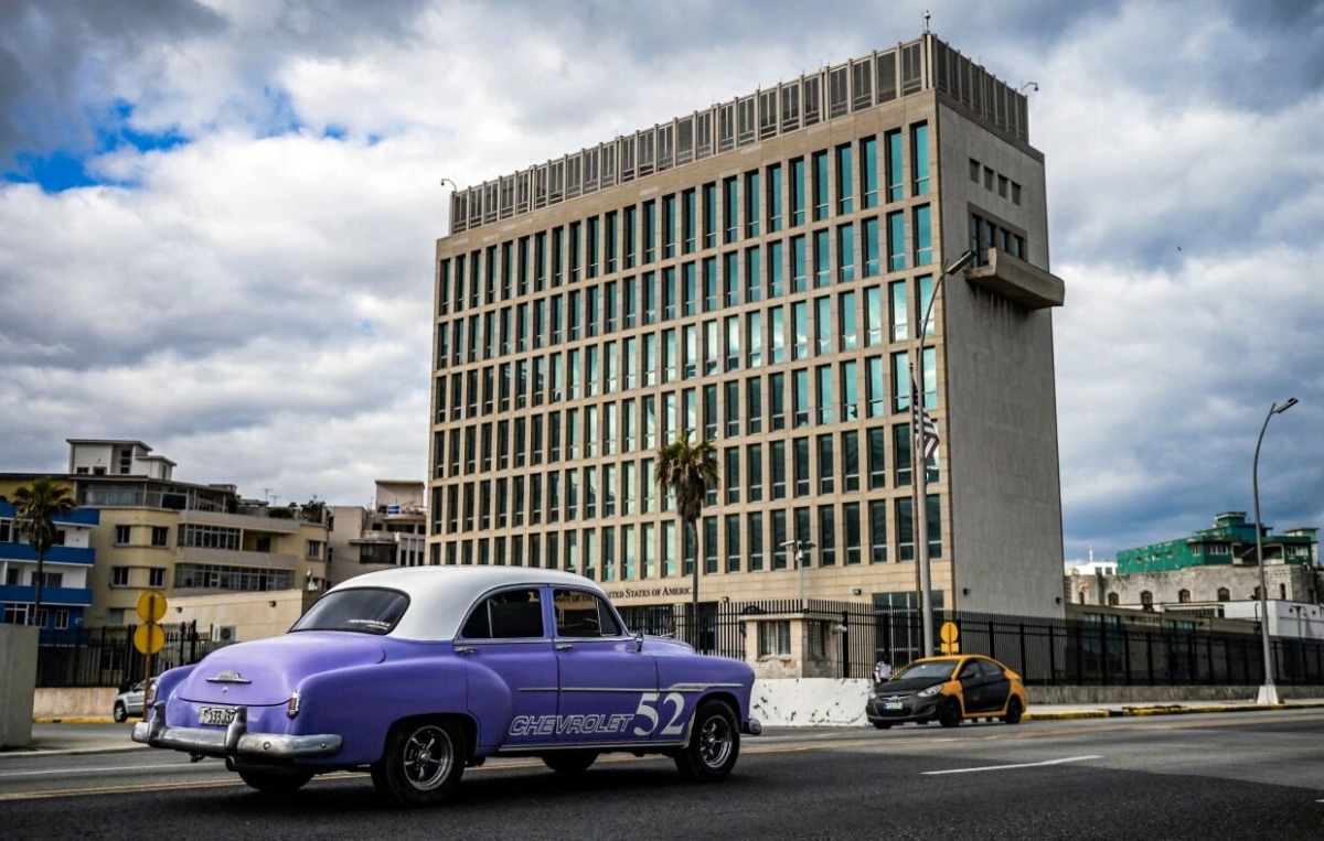 A classic American car passes the US embassy in Havana last year. File photo / AFP
