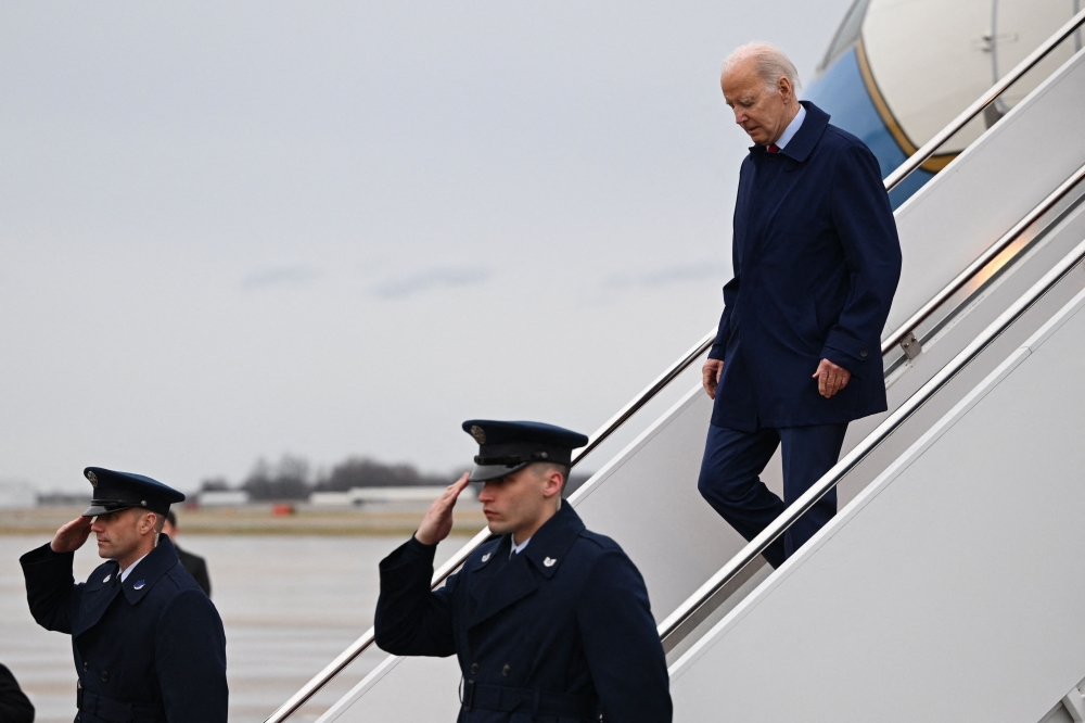 US President Joe Biden steps off Air Force One upon arrival at Delaware National Air Guard Base in New Castle, Delaware, on March 3, 2023. - Biden is scheduled to spend the weekend at his Wilmington residence. (Photo by Mandel NGAN / AFP)