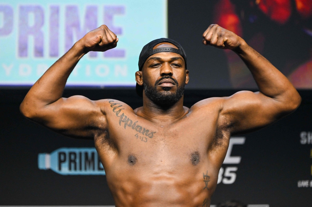 US mixed martial arts fighter Jon Jones stands on a scale during the weigh-in before his UFC 285 heavyweight title bout against French mixed martial arts fighter Ciryl Gane at the MGM Garden Arena, in Las Vegas, Nevada on March 3, 2023. (Photo by Patrick T. Fallon / AFP)