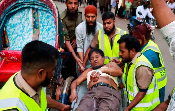 Emergency personnel shift an injured man to the Dhaka Medical College Hospital in Dhaka on March 7, 2023, following an explosion inside an office building. (AFP)