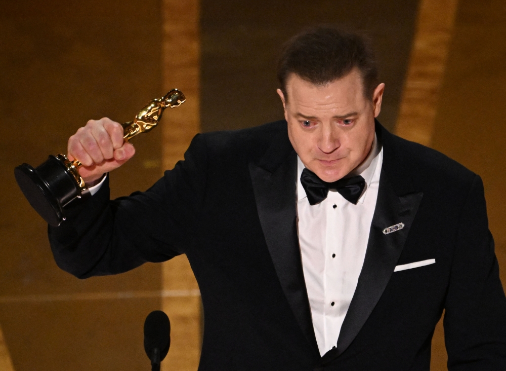 US actor Brendan Fraser accepts the Oscar for Best Actor in a Leading Role for
