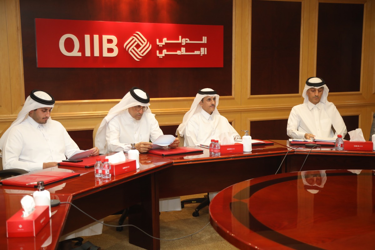 QIIB Chairman Sheikh Dr Khalid bin Thani bin Abdullah Al Thani (second right) with other officials at the AGM.