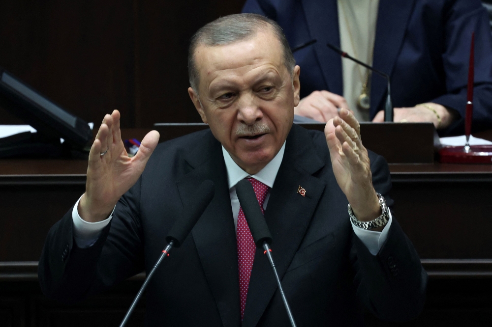 Turkish President and leader of the Justice and Development Party (AKP), Recep Tayyip Erdogan delivers a speech during the party's group meeting at the Turkish Grand National Assembly in Ankara on March 15, 2023. (Photo by Adem Altan / AFP)