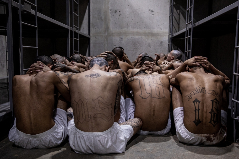 This handout picture released by the El Salvador's Presidency shows the second arrival of inmates belonging to the MS-13 and 18 gangs to the new prison 