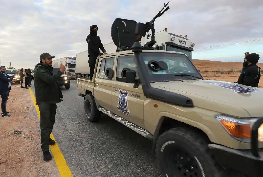Libyan special forces in charge of illegal migration assemble in the southern region of Bani Walid, on January 14, 2023, ahead of their mission as part of a security plan to enforce inspections at points of entry through the desert borders. (AFP)