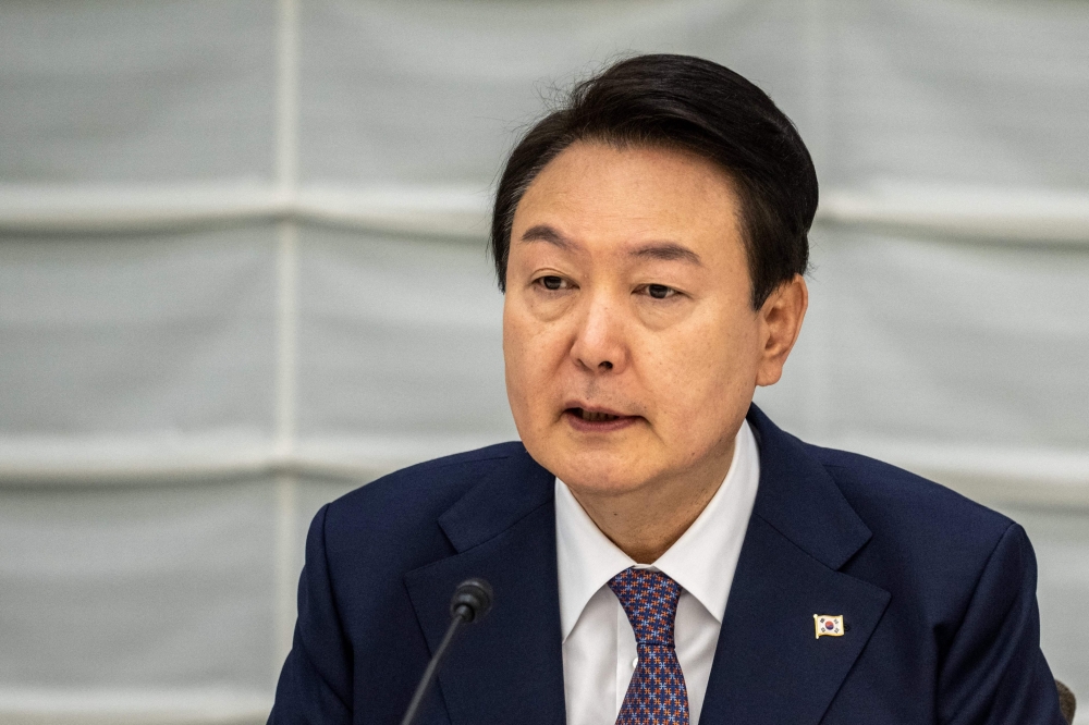 South Korea's President Yoon Suk Yeol attends a meeting between the Japan Business Federation, or Keidanren, and South Korean business leaders during a Japan-Korea Business Roundtable meeting in Tokyo on March 17, 2023. (Photo by Philip FONG / POOL / AFP)