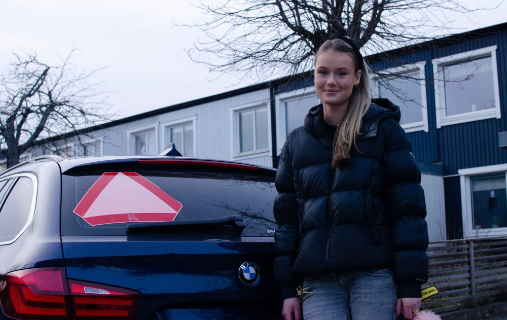 Picture taken on February 10, 2023 shows Evelina Christiansen, 15, posing next to a car in Huddinge, Sweden. Photo by Alma COHEN / AFP