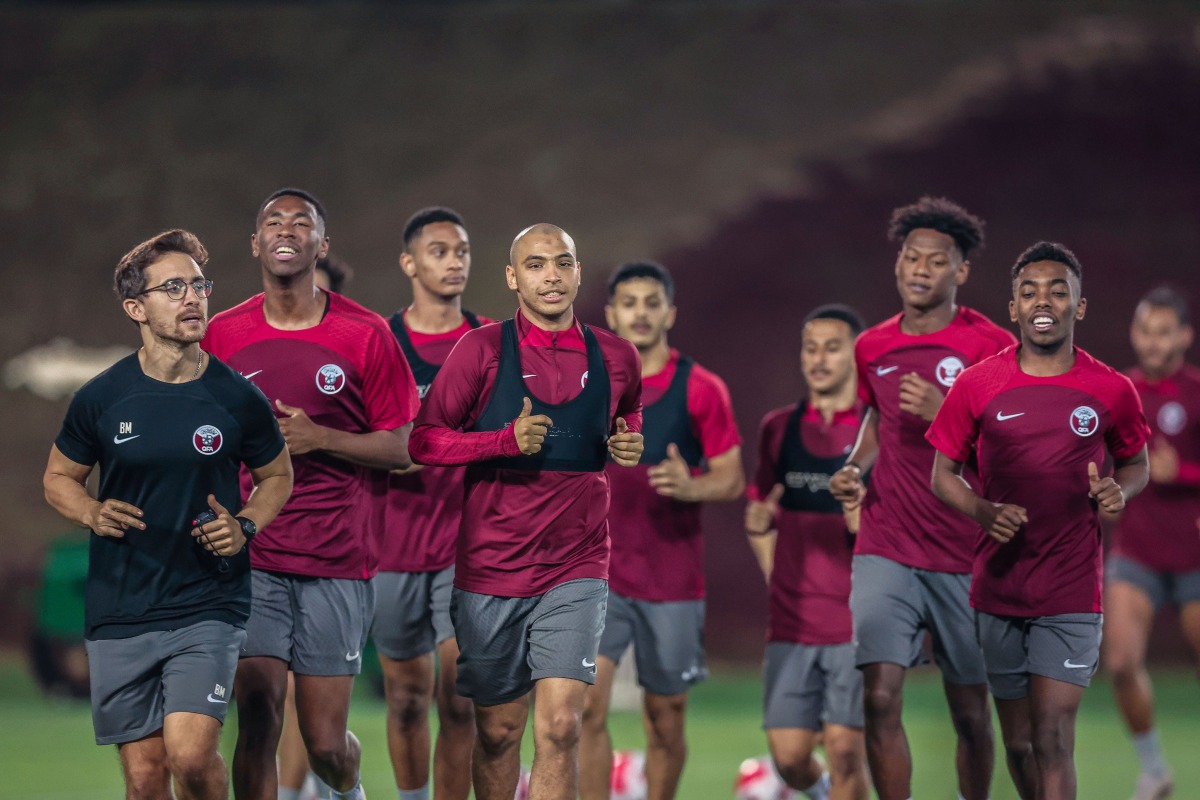 Qatar U23 players in action during a training session.