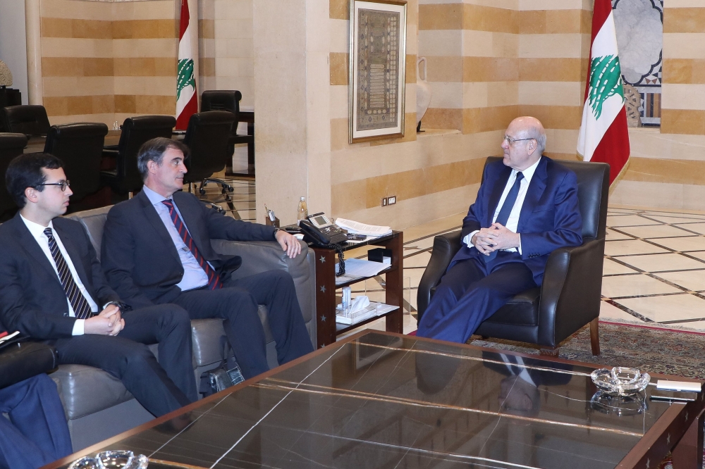 A handout picture provided by the Lebanese photo agency Dalati and Nohra on March 23, 2023 shows Lebanese caretaker prime minister Najib Mikati meeting with a delegation from the International Monetary Fund (IMF) at the governmental palace in Beirut on March 23, 2023. (Photo by DALATI AND NOHRA / AFP)