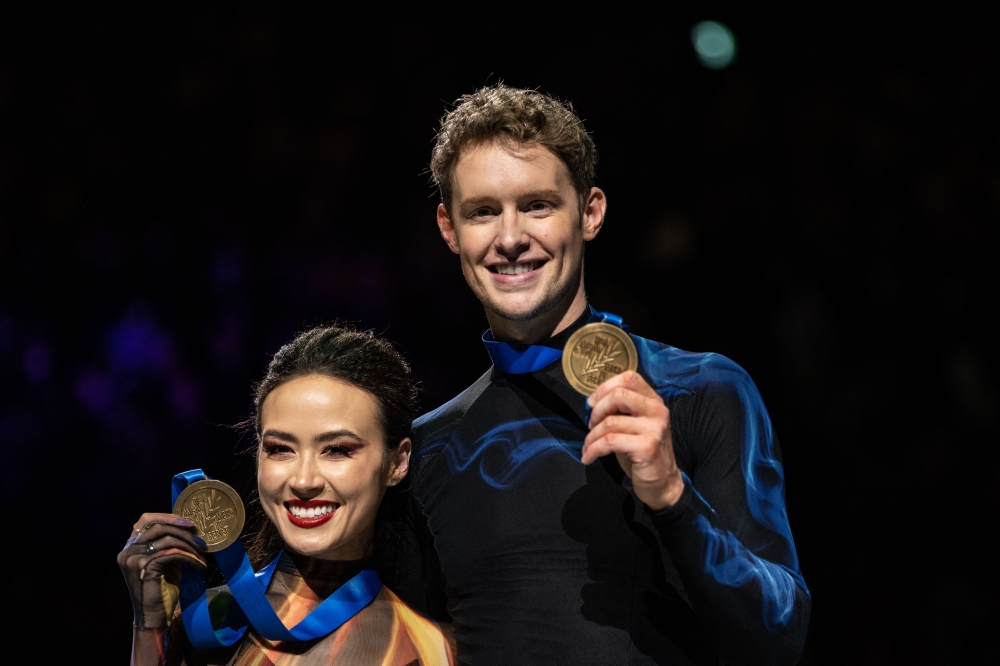 Gold medallists USA's Madison Chock and Evan Bates pose during the medals ceremony for the ice dance event during the ISU World Figure Skating Championships 2023 in Saitama on March 25, 2023. (Photo by Philip Fong / AFP)