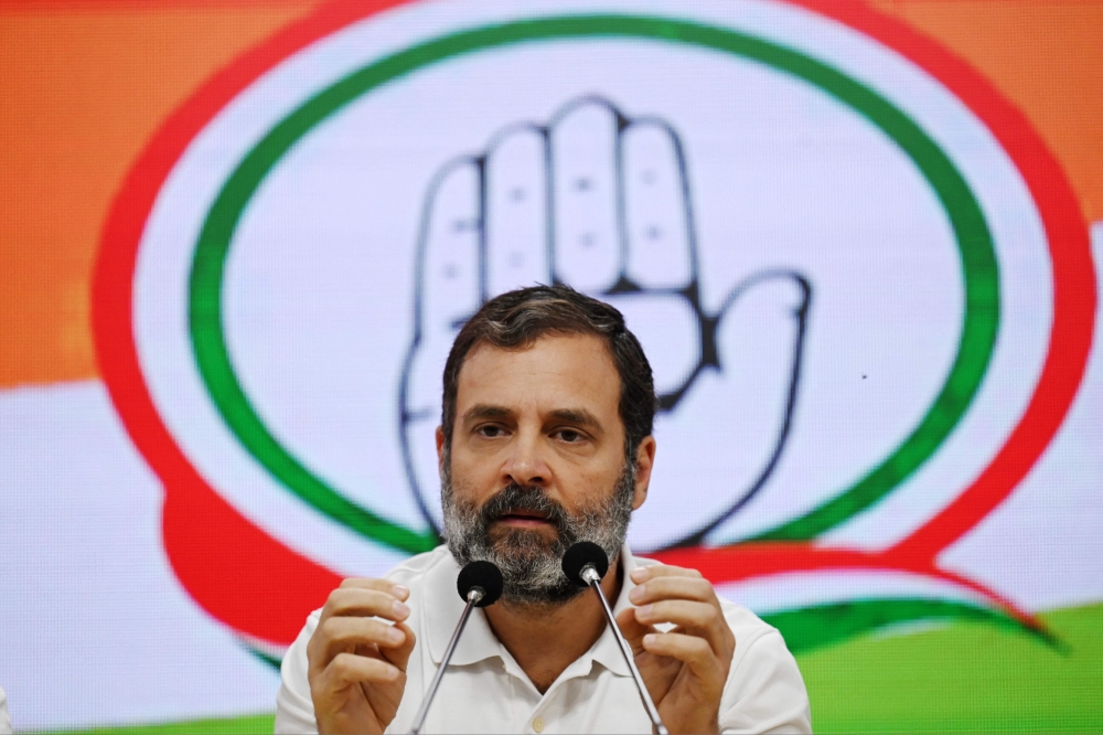 Congress party leader Rahul Gandhi speaks during a press conference in New Delhi on March 25, 2023, after being disqualified as a member of parliament. - Gandhi has been disqualified from parliament as a result of his conviction for defamation, a notice from the national legislature said on March 24. (Photo by Money SHARMA / AFP)