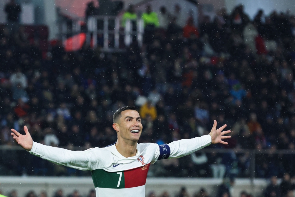 Portugal's forward Cristiano Ronaldo celebrates after scoring his team's first goal during the UEFA Euro 2024 group J qualification football match between Luxembourg and Portugal at the Stade de Luxembourg, in Luxembourg, on March 26, 2023. Photo by Kenzo TRIBOUILLARD / AFP