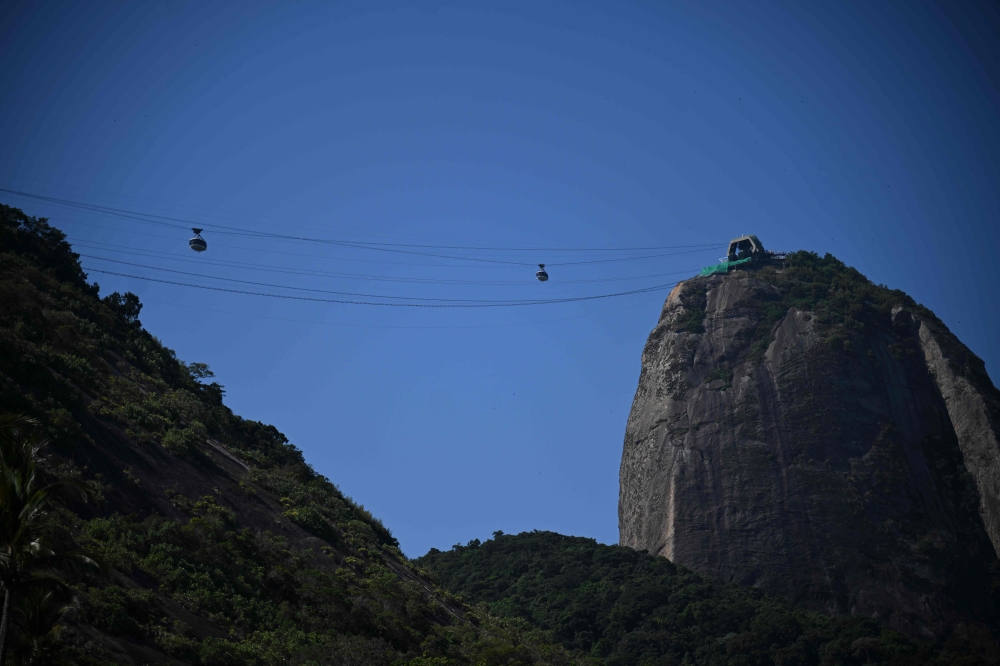 View of a Sugarloaf Cable Cars during a demonstration against proposals to create a zip line attraction at Sugarloaf Mountain in Rio de Janeiro, Brazil, on March 26, 2023. Photo by CARL DE SOUZA / AFP