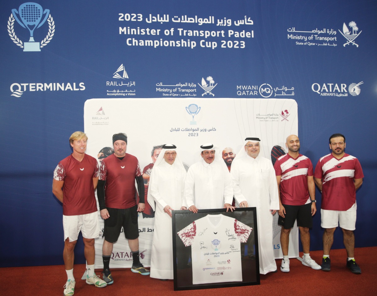 Minister of Transport H E Jassim Saif Ahmed Al Sulaiti; Qatar Airways Group Chief Executive H E Akbar Al Baker; and President of Ashghal and Mowasalat (Karwa) Chairman Dr. Eng Saad bin Ahmad Al Muhannadi pose with the winning team during the second edition of the Minister of Transport Ramadan Padel Championship Cup 2023 at Padel-In Aspire Zone.