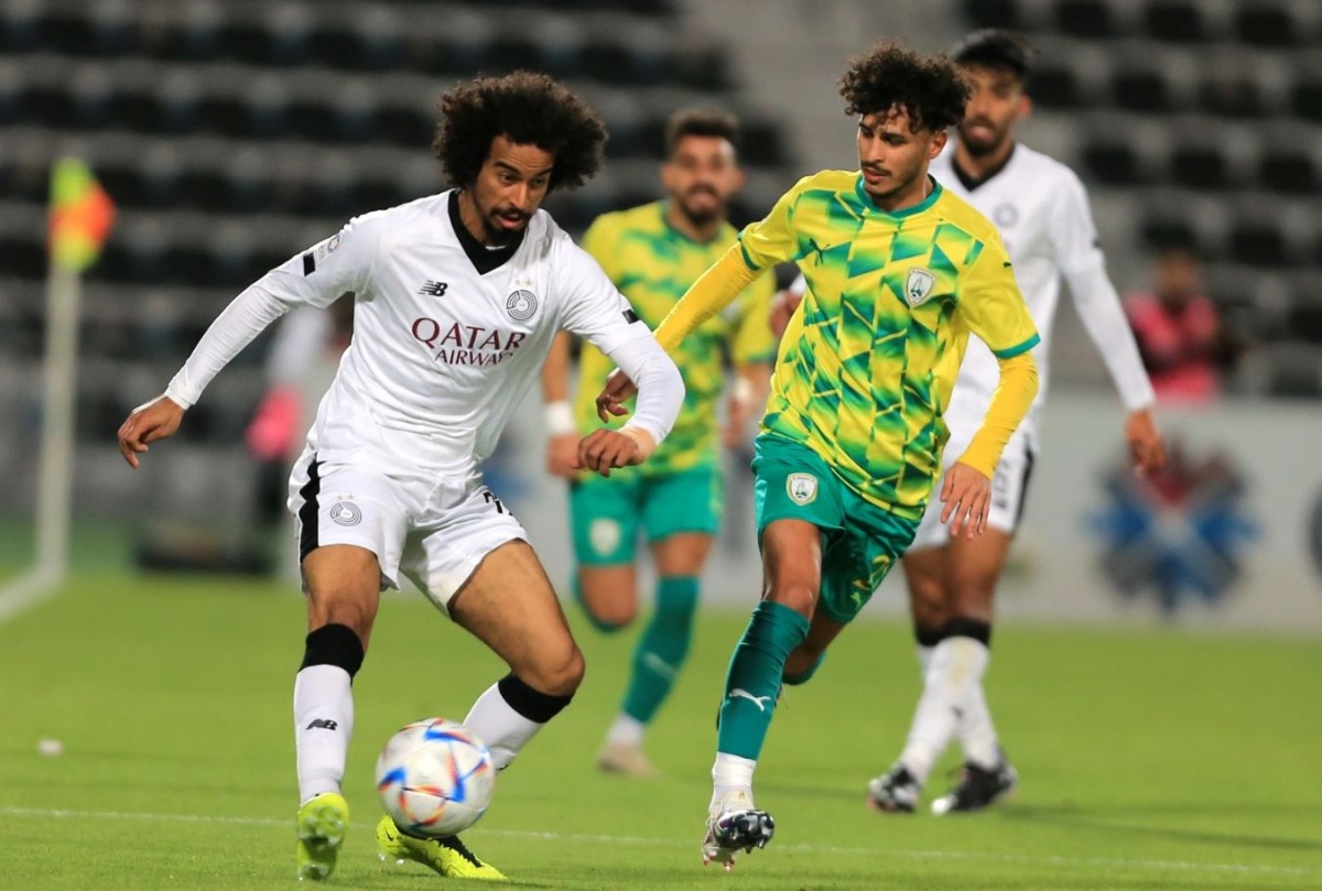 Al Sadd’s Akram Afif (left) in action during match against Al Wakrah at Saoud Bin Abdulrahman Stadium. RIGHT: Al Duhail’s Ferjani Sassi (left) celebrates with captain Karim Boudiaf after scoring his team’s first goal at Hamad Bin Khalifa Stadium. 