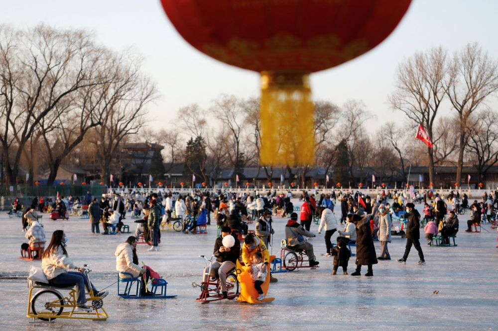 File Photo: People enjoy an ice rink on a frozen lake, amid the COVID-19 outbreak in Beijing, China December 31, 2022. (REUTERS/Florence Lo)