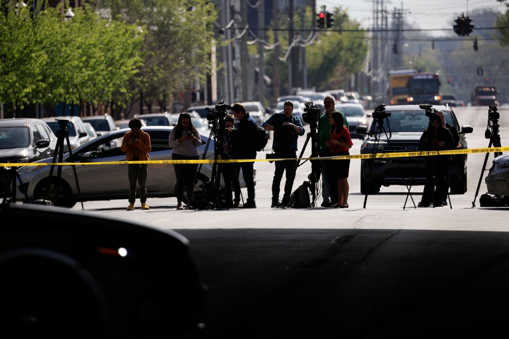 Members of the media work at the scene of an active shooter at the Old National Bank building on April 10, 2023 in Louisville, Kentucky. (Luke Sharrett/Getty Images/AFP)