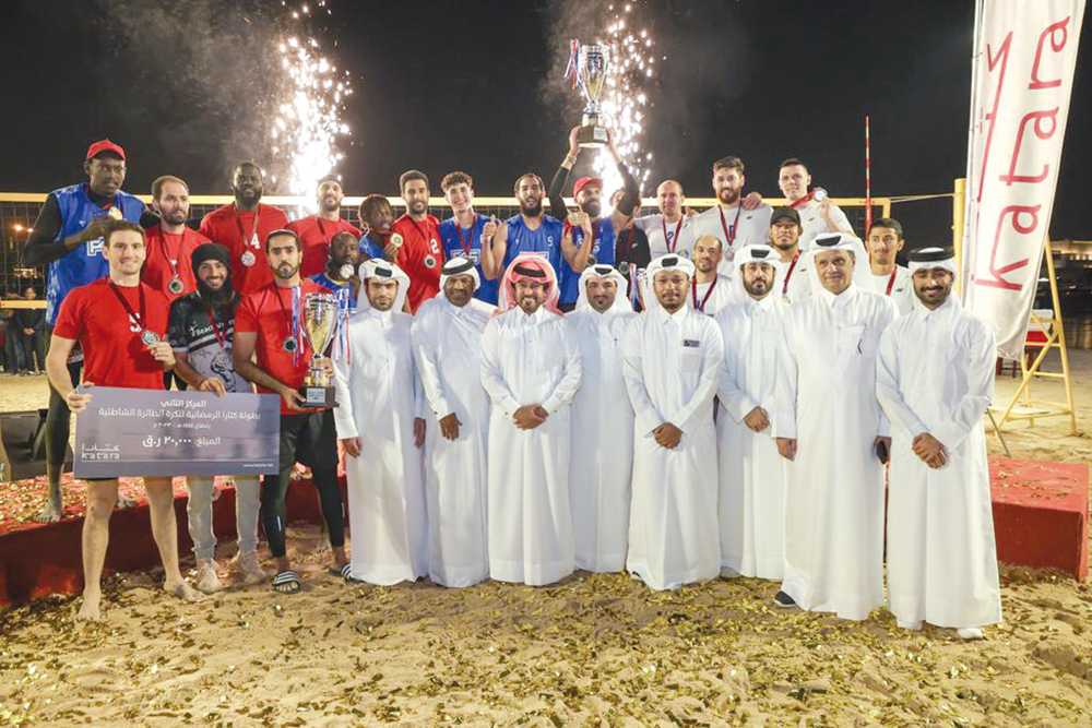 Winners of the Katara Ramadan Beach Volleyball Championship along with Katara officials.