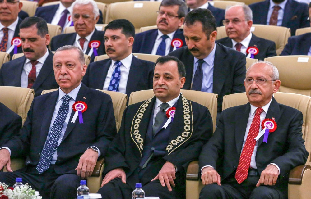 This handout picture released by the Republican People's Party press office on April 25, 2023 shows Turkish President Recep Tayyip Erdogan (left) and the leader of the Republican People's Party (CHP) and presidential candidate Kemal Kilicdaroglu (right) attending a ceremony marking the 61st anniversary of the Constitutional Court of the Republic of Turkey, in Ankara, on April 25, 2023. (Photo by Republican People's Party press office / AFP) 