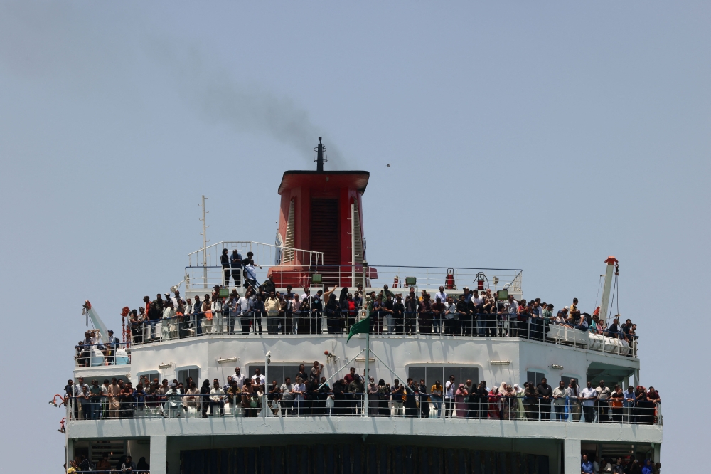 A ferry transports some 1900 evacuees across the Red Sea from Port Sudan to the Saudi King Faisal navy base in Jeddah, on April 29, 2023, during evacuation efforts of people fleeing Sudan.   (Photo by Fayez NURELDINE / AFP)
