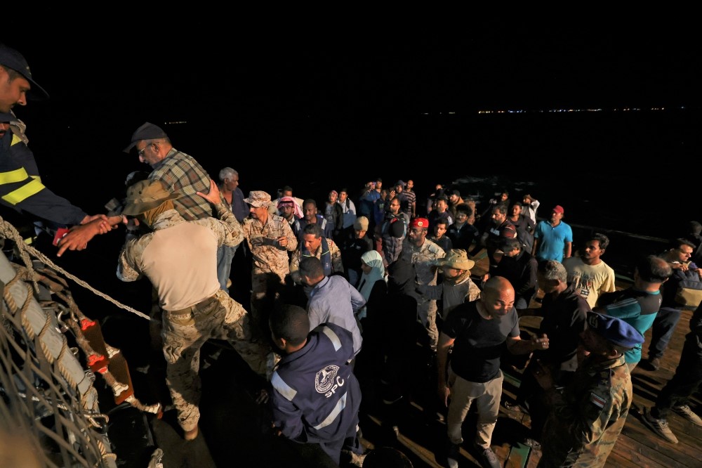 Saudi naval and special forces hoist evacuees aboard a vessel during a rescue operation from Port Sudan to Jeddah, on April 30, 2023. (Photo by Fayez Nureldine / AFP)