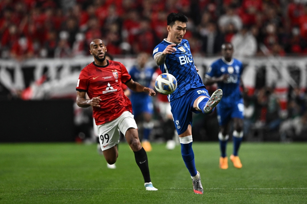 Hilal's Jang Hyun-soo (R) and Urawa Reds' Jose Kante vie for the ball during the second leg of the AFC Champions League final between Urawa Red Diamonds and Al-Hilal at Saitama Stadium in Saitama on May 6, 2023. (Photo by Philip Fong / AFP)