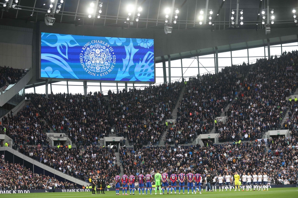 A screen shows a message for the coronation of King Charles III prior to the start of the English Premier League football match between Tottenham Hotspur and Crystal Palace at Tottenham Hotspur Stadium in London, on May 6, 2023. (Photo by ISABEL INFANTES / AFP) 