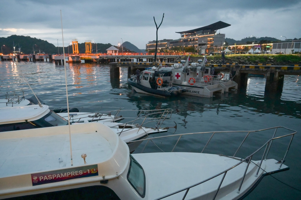 Indonesian Navy patrol and ambulance boats (C) are seen in front of the Meruorah Hotel, the main venue for the Association of Southeast Asian Nations (ASEAN) Summit, in Labuan Bajo on May 8, 2023, on the eve of the event. (Photo by Bay ISMOYO / AFP)