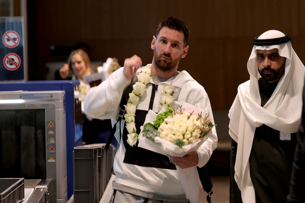 In this file photo taken on January 19, 2023, Paris Saint-Germain's Argentinian forward Lionel Messi arrives at an airport in Riyadh, ahead of a friendly football match against a select side made up of players from Cristiano Ronaldo's new club Al Nassr and their Saudi rivals Al Hilal. (Photo by Fayez Nureldine / AFP)
